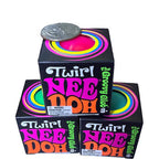 Stacked NeeDoh Twirl The Groovy Glob boxes with a coin on top for size