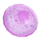 A pink NeeDoh Groovy Jewel squishy showing its glitter and embossed logo